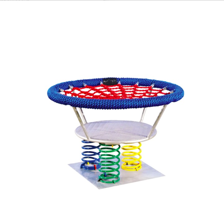Bunte Federwippe mit runder Netz-Sitzfläche und Metallplattform für Kinder auf dem Spielplatz